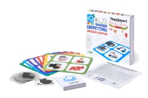 IQ Лото «Знайди силует (тінь)» — розвивальна гра для дітей 3–6 років у новорічному стилі. Коробка, ігрові поля та прозорі картки з силуетами предметів.