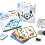 IQ Лото «Знайди силует (тінь)» — розвивальна гра для дітей 3–6 років у новорічному стилі. Коробка, ігрові поля та прозорі картки з силуетами предметів.